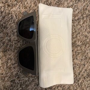 Stylish Black Sunglasses with White Case
